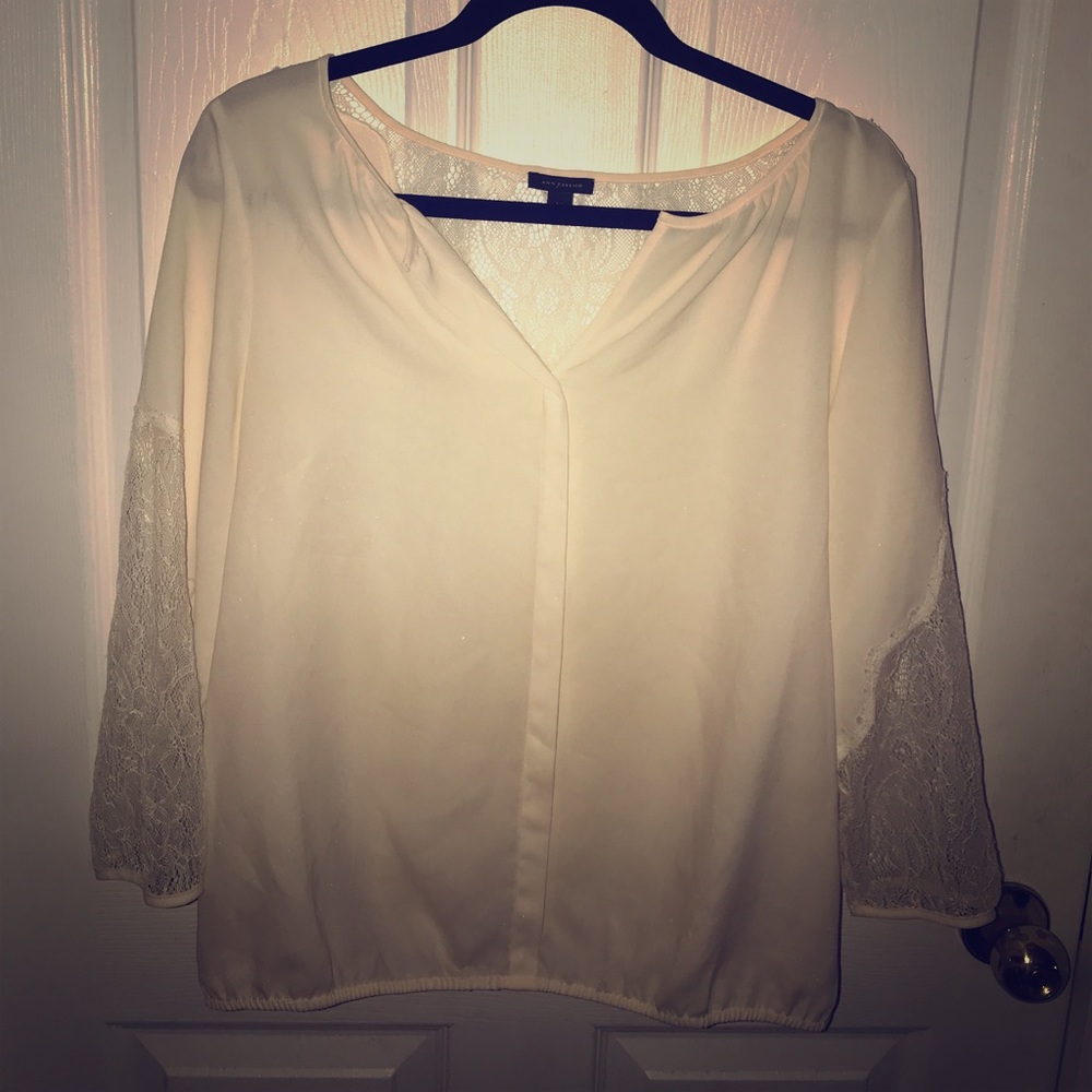 Ann Taylor ivory colored button free blouse